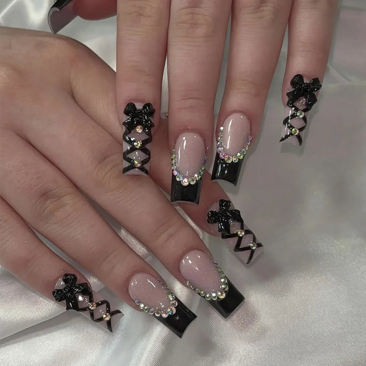 24pcs long coffin French press-on nails in black, featuring elegant bow and diamond details. Chic ballerina-style acrylic nails for a glamorous manicure in minutes.