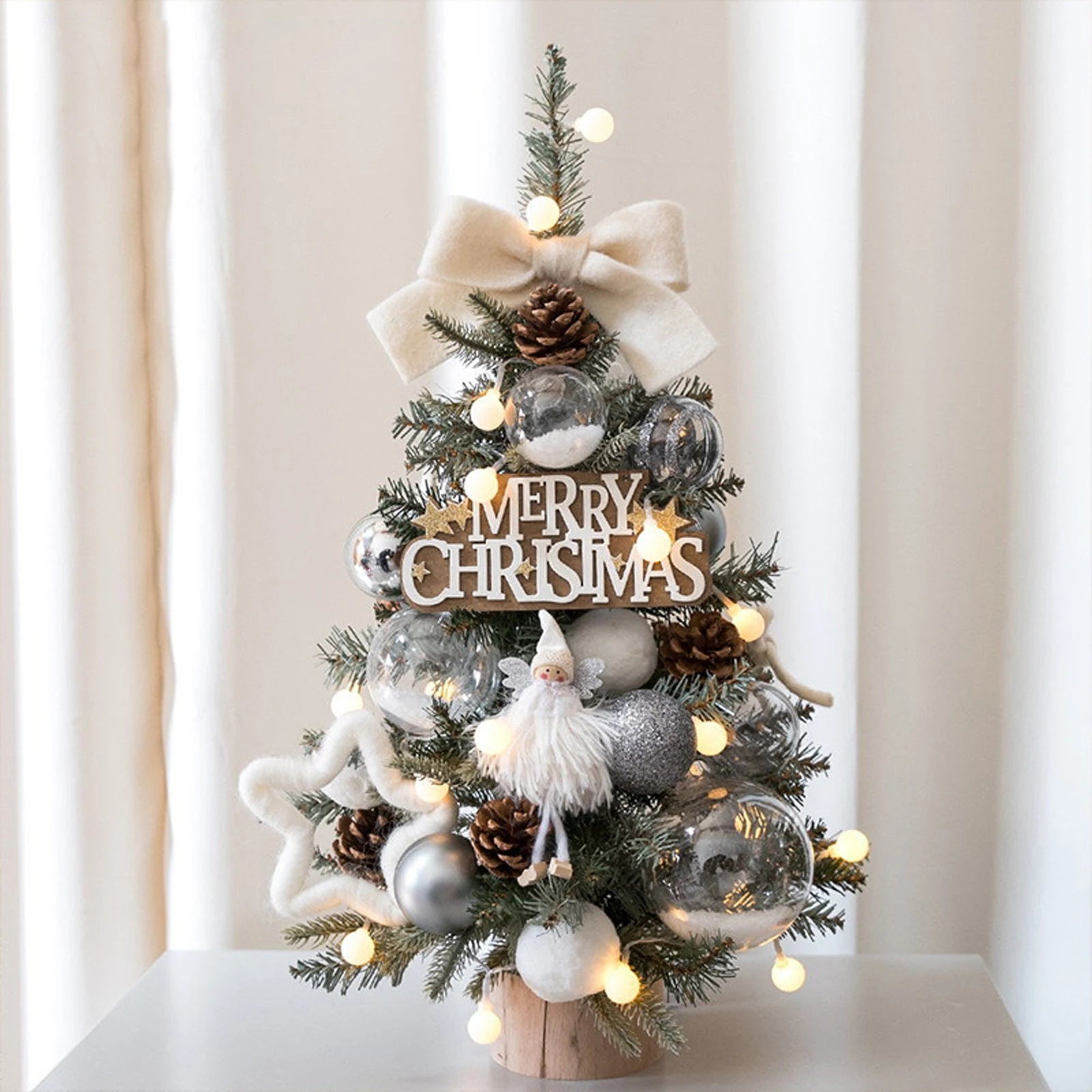 Add a festive touch to your home or office with this adorable miniature Christmas tree. Perfect for desks, tables, or as a Christmas gift.
